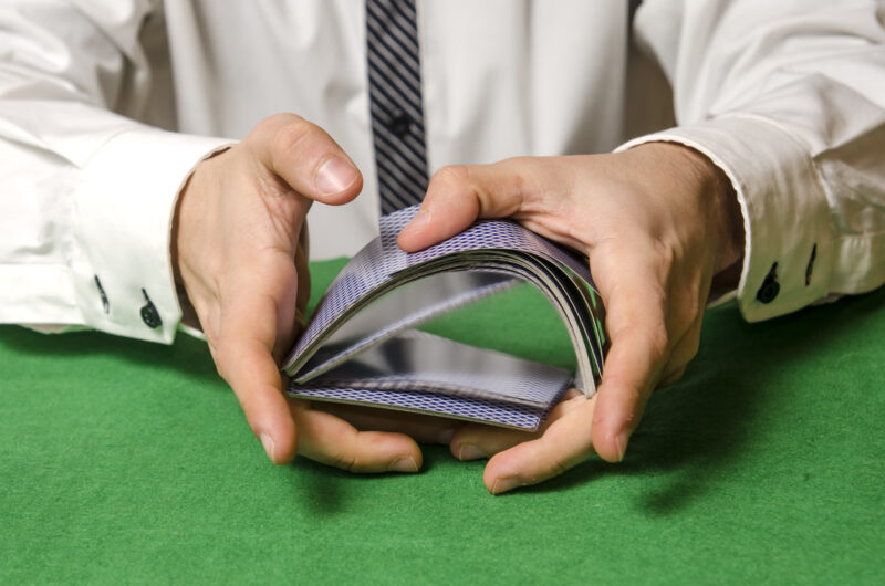 Closeup,Of,Hands,Shuffling,Cards,Casino